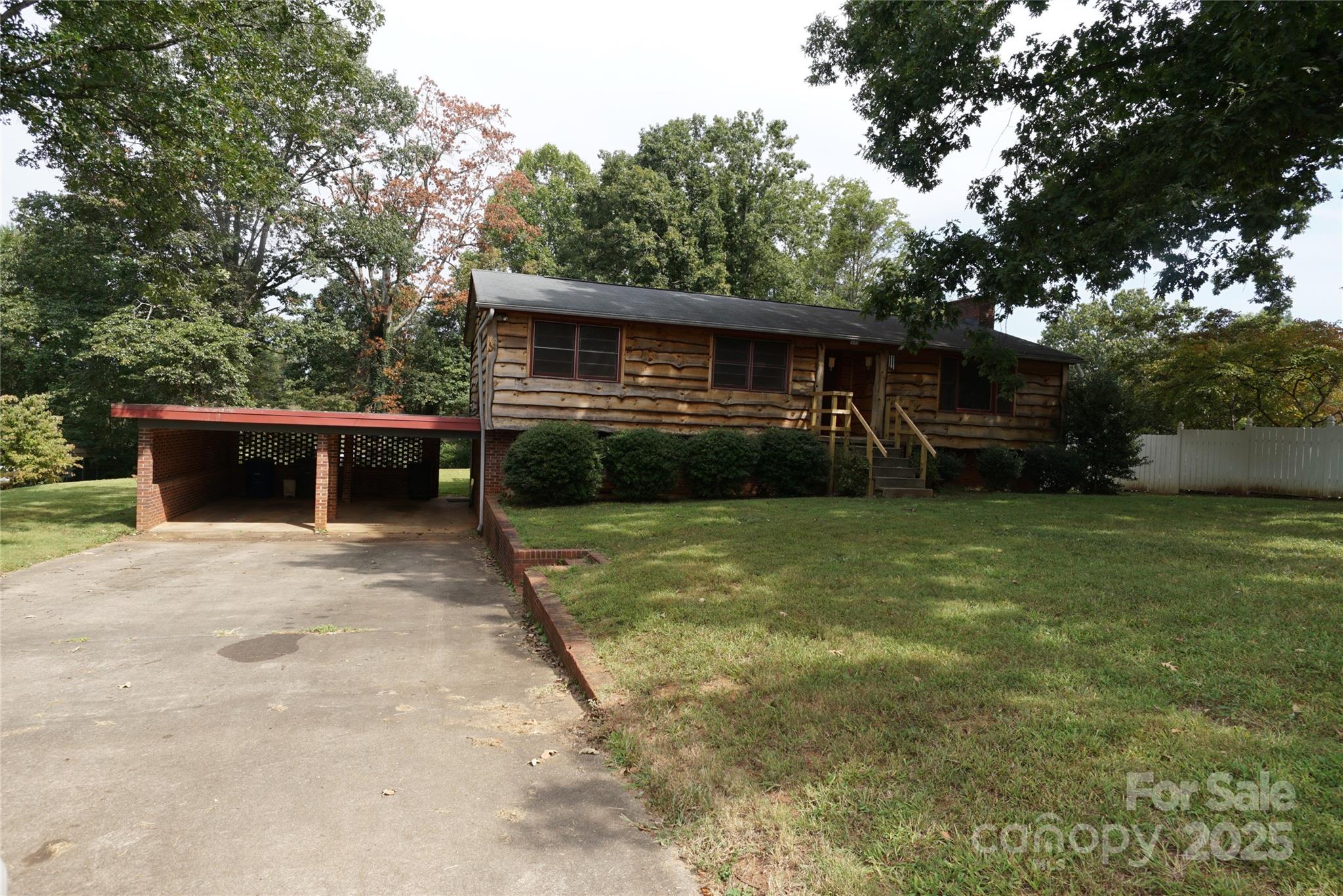 1605 3rd Street Northeast Conover, NC 28613 - Photo 1 of 19 a front view of house with a garden