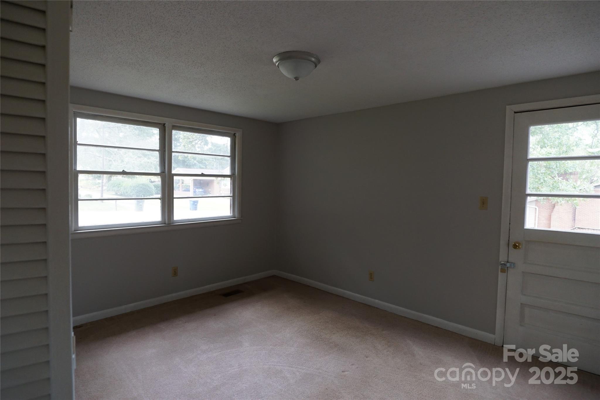 1605 3rd Street Northeast Conover, NC 28613 - Photo 11 of 19 an empty room with a window