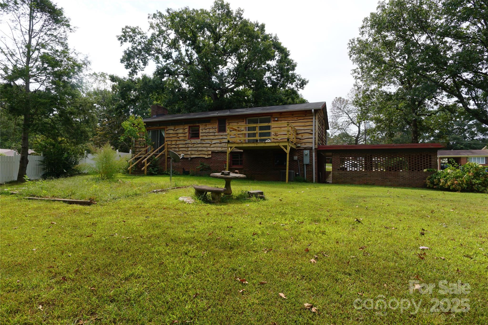 1605 3rd Street Northeast Conover, NC 28613 - Photo 18 of 19 a view of a backyard with a garden