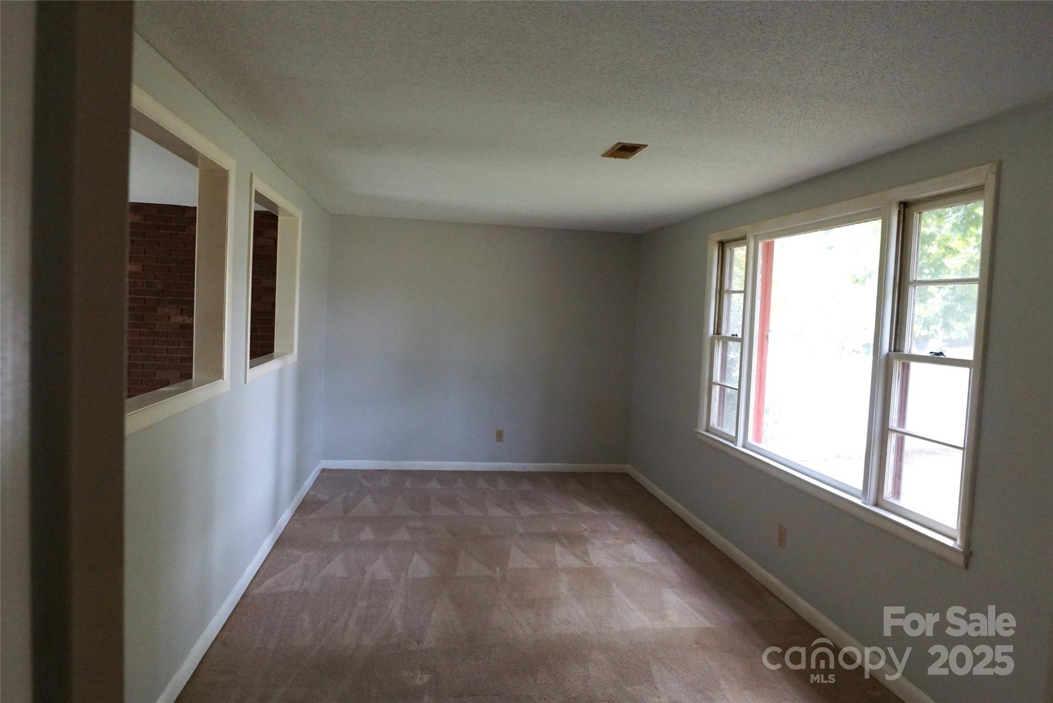 1605 3rd Street Northeast Conover, NC 28613 - Photo 3 of 19 a view of an empty room with a window