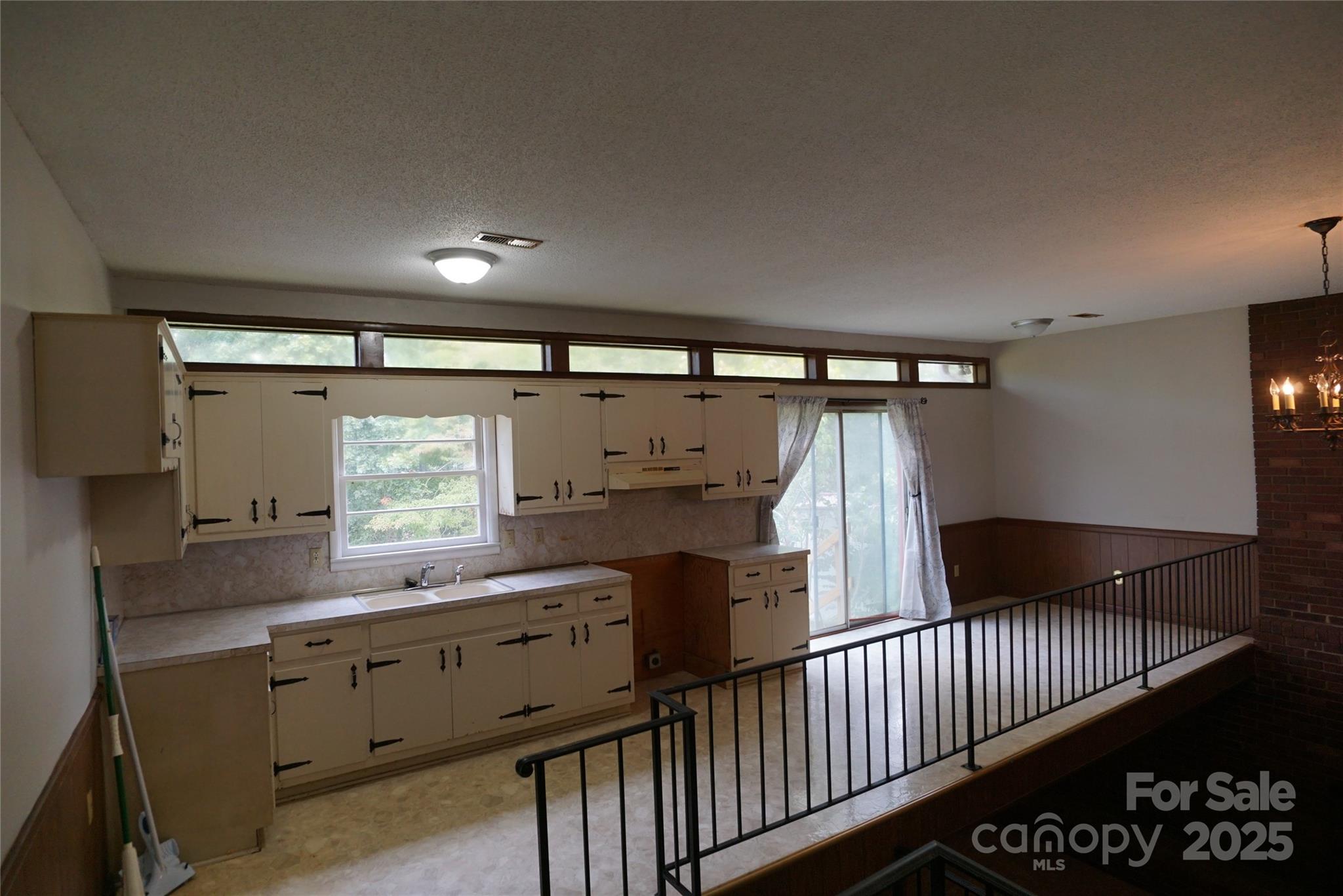 1605 3rd Street Northeast Conover, NC 28613 - Photo 4 of 19 a kitchen with refrigerator and window