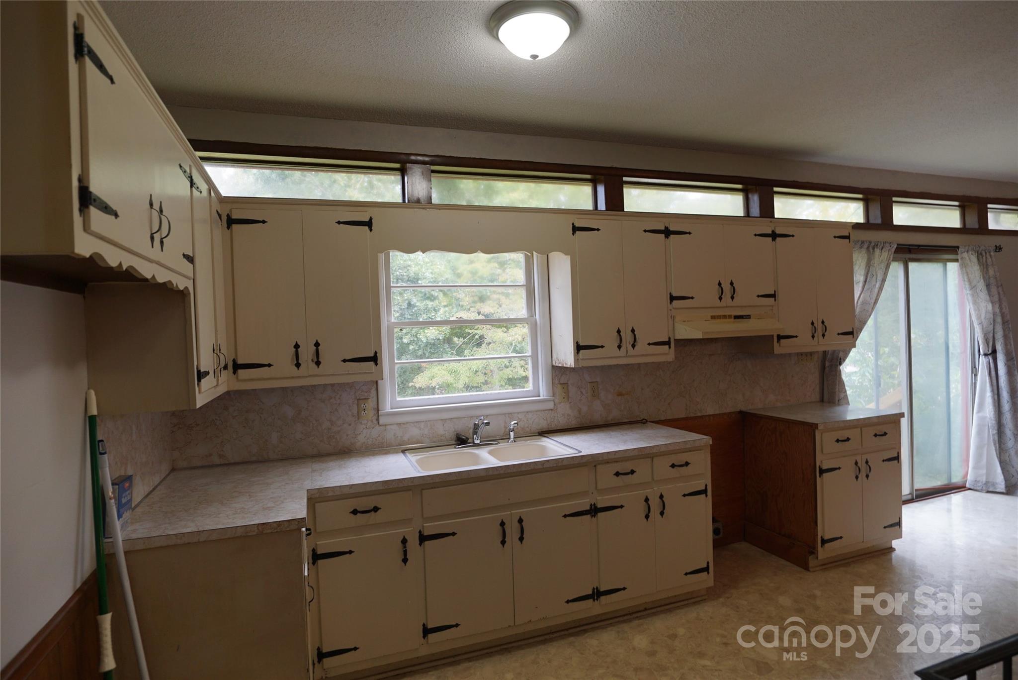1605 3rd Street Northeast Conover, NC 28613 - Photo 5 of 19 a kitchen with stainless steel appliances a sink stove and cabinets