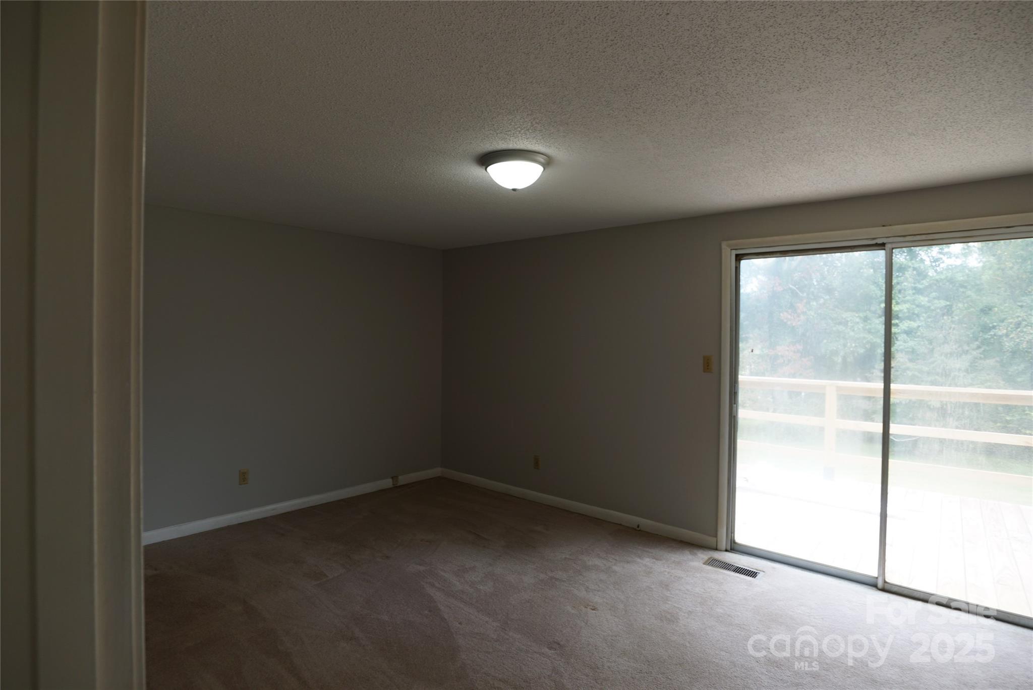 1605 3rd Street Northeast Conover, NC 28613 - Photo 6 of 19 an empty room with a empty space and windows