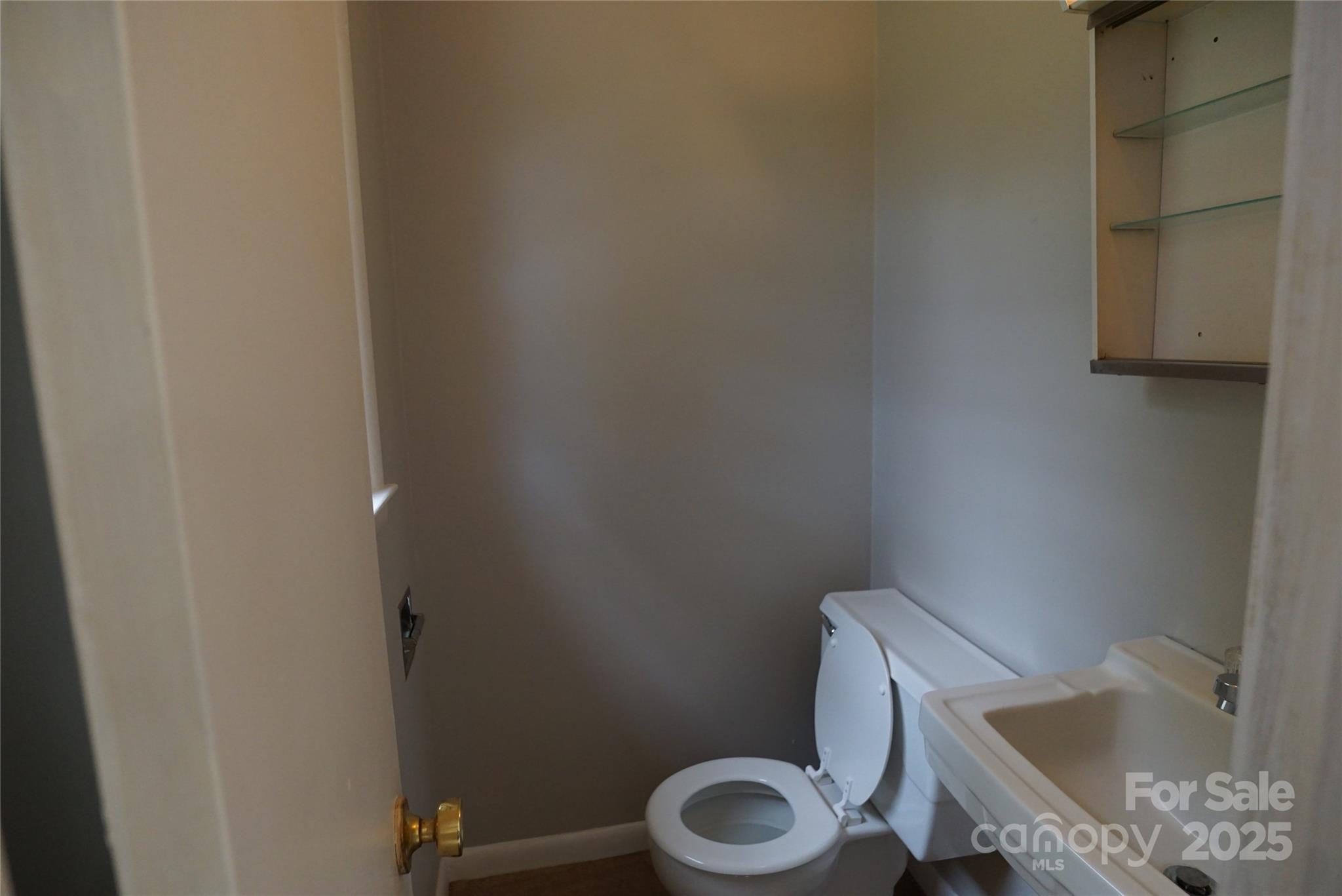 1605 3rd Street Northeast Conover, NC 28613 - Photo 9 of 19 a white toilet sitting next to a bath tub