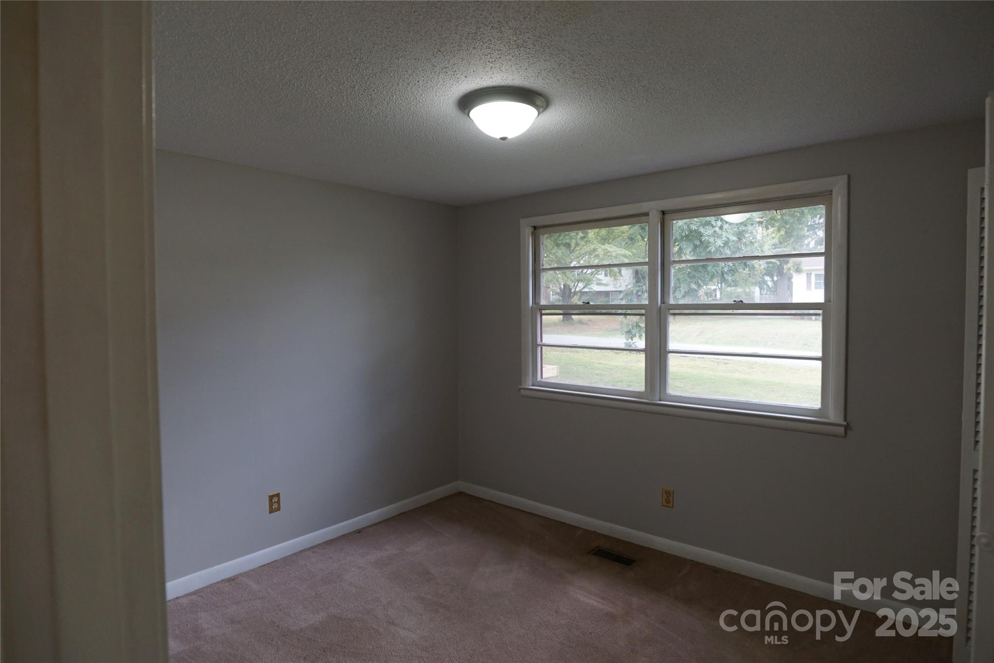 1605 3rd Street Northeast Conover, NC 28613 - Photo 10 of 19 an empty room with a window
