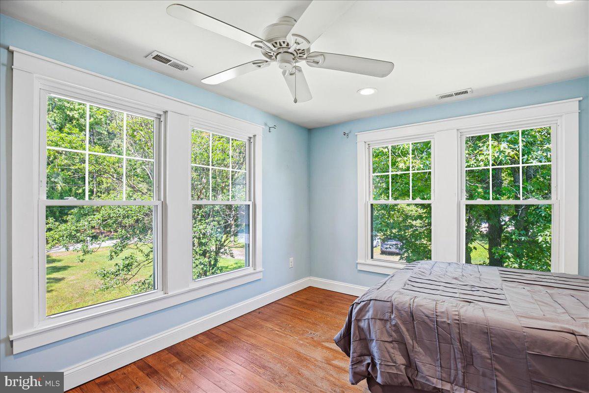 16146 Thomas Road Piney Point, MD 20674 - Photo 45 of 70 a bed sitting in a bedroom next to a window