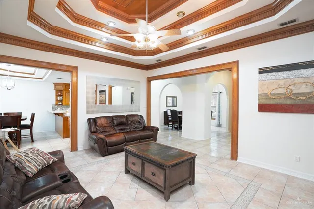 a living room with furniture and a walk in closet