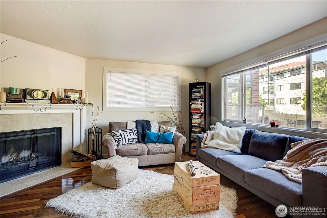 2357 Northwest 65th Street Seattle, WA 98117 - Photo 8 of 20 a living room with furniture and a fireplace