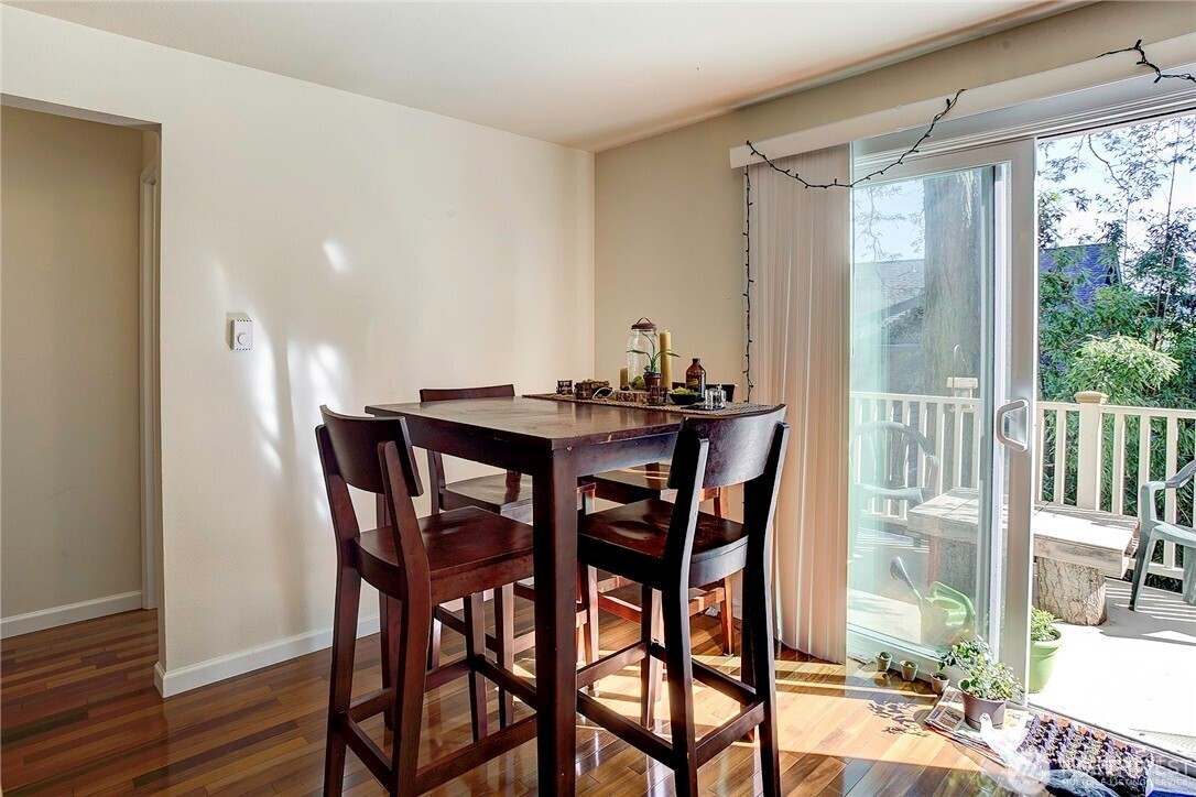 2357 Northwest 65th Street Seattle, WA 98117 - Photo 9 of 20 a view of a dining room with furniture and wooden floor