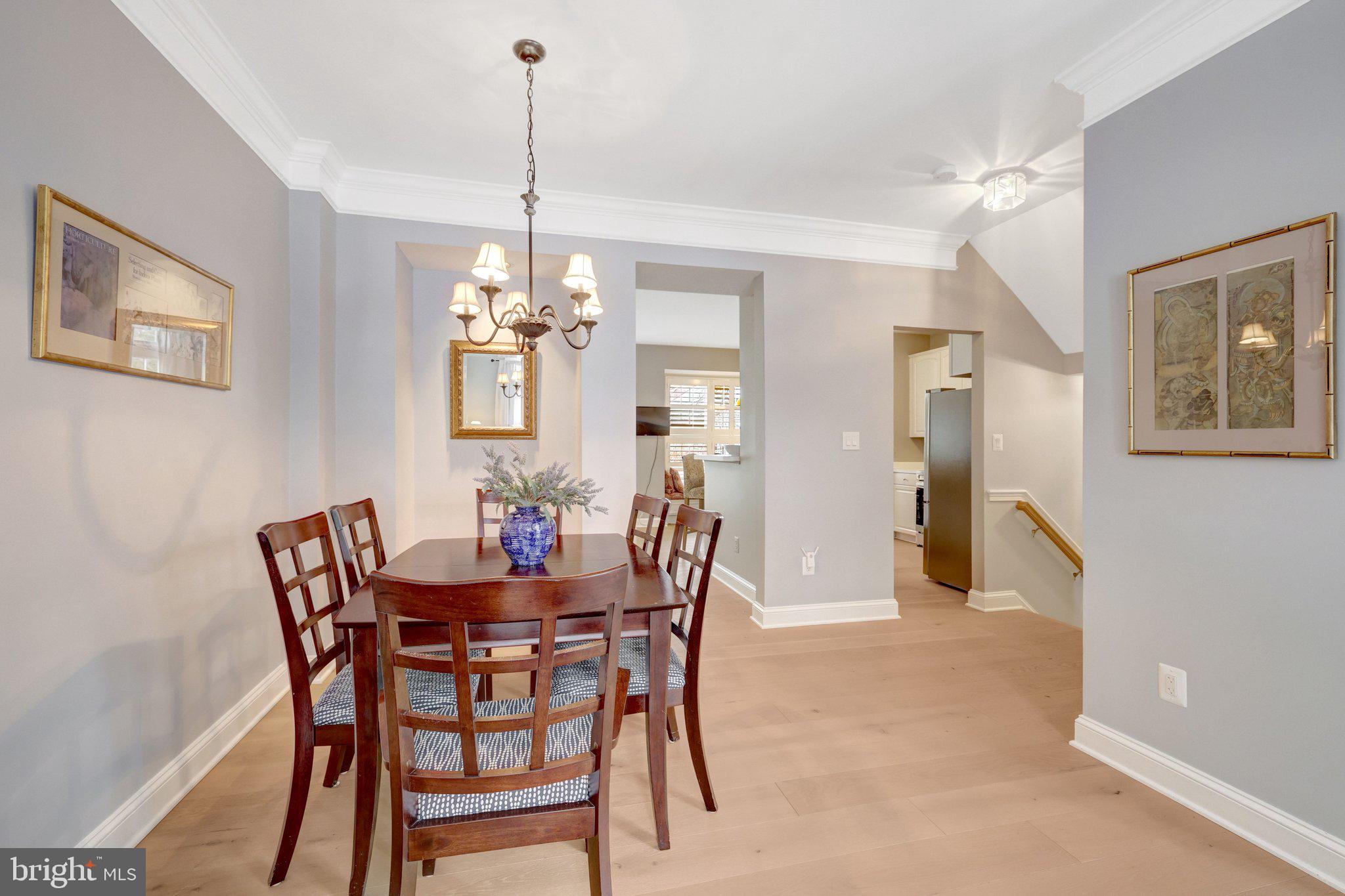 1309 Sundial Drive Reston, VA 20194 - Photo 12 of 45 a dining room with furniture a chandelier and window