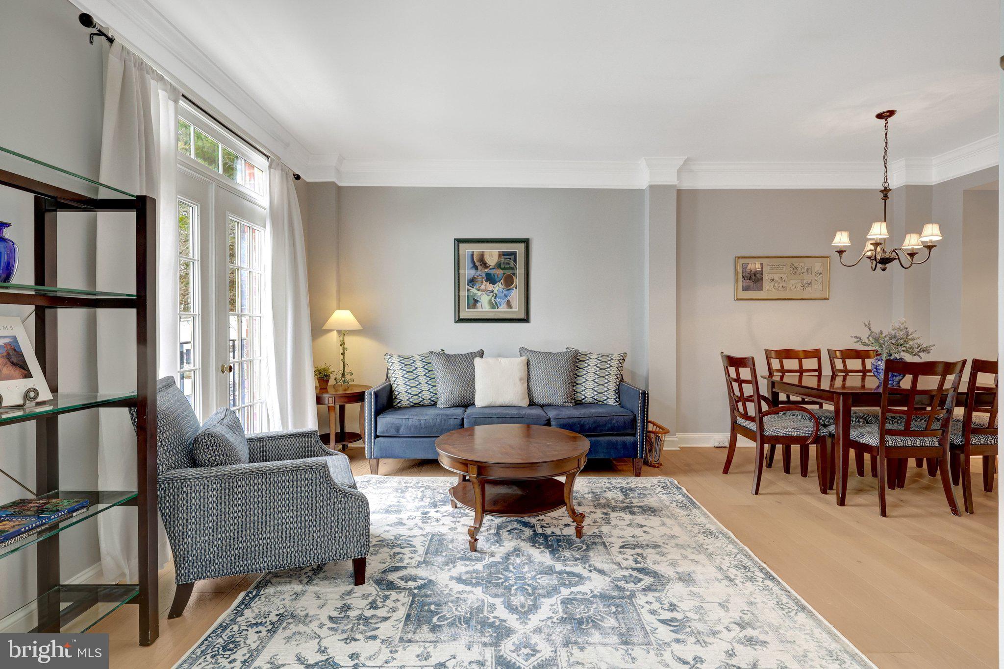 1309 Sundial Drive Reston, VA 20194 - Photo 15 of 45 a living room with furniture a rug and a chandelier