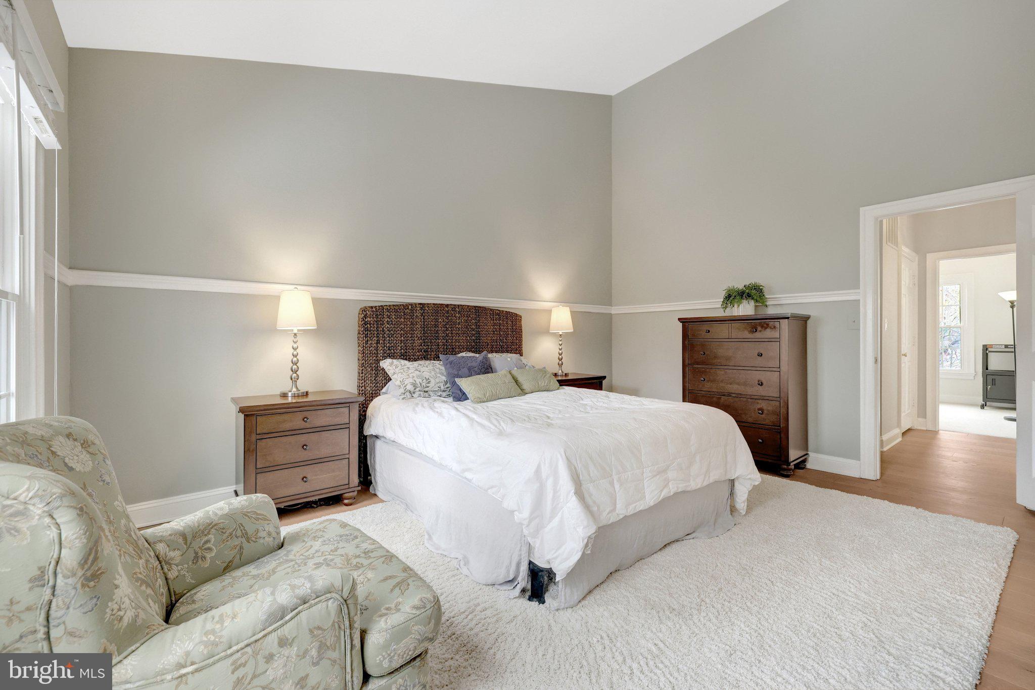 1309 Sundial Drive Reston, VA 20194 - Photo 20 of 45 a bedroom with a bed and wooden floor