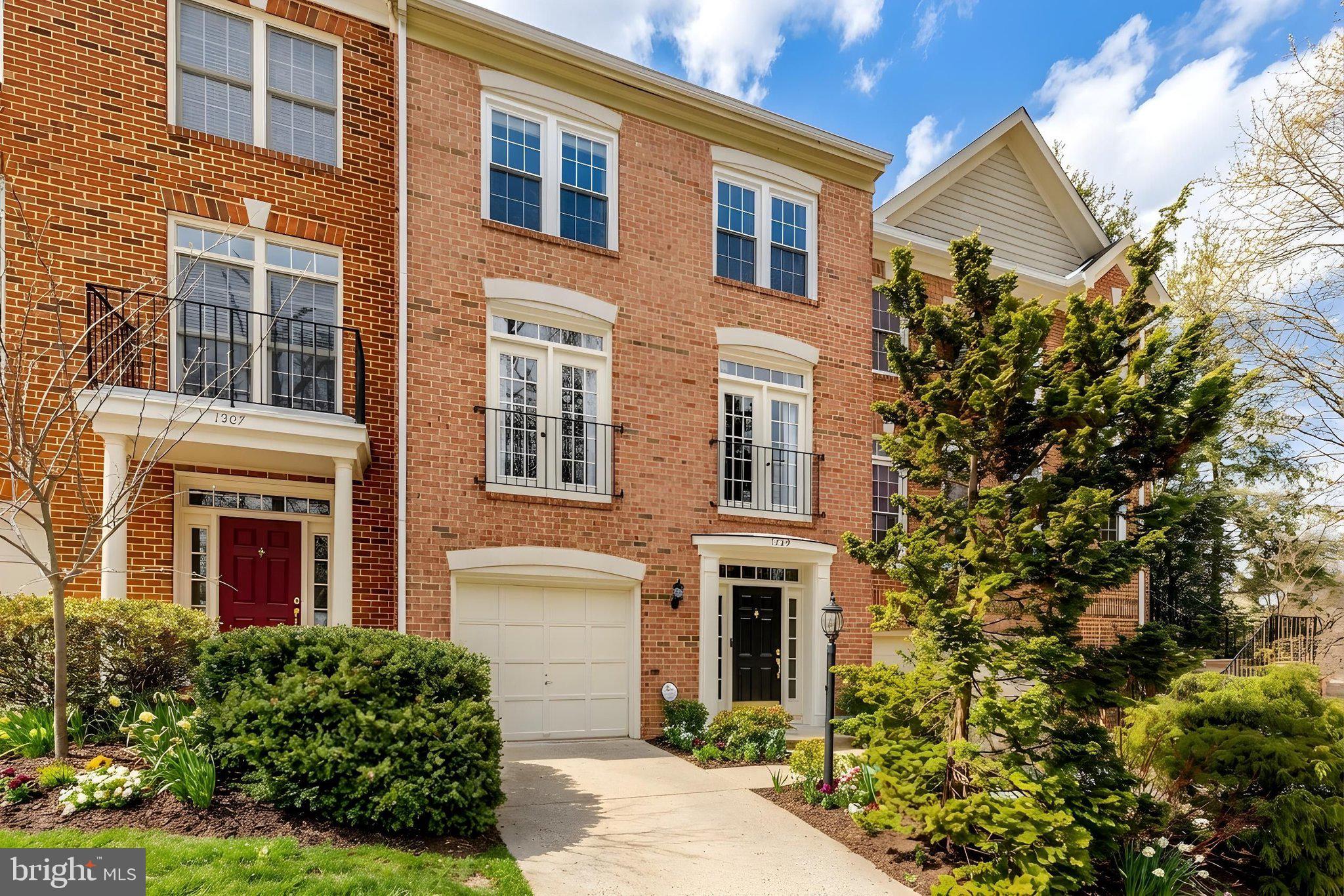 1309 Sundial Drive Reston, VA 20194 - Photo 2 of 45 a front view of a house with a garden