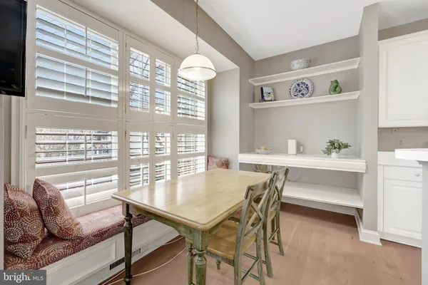 a view of a dining room with furniture and window