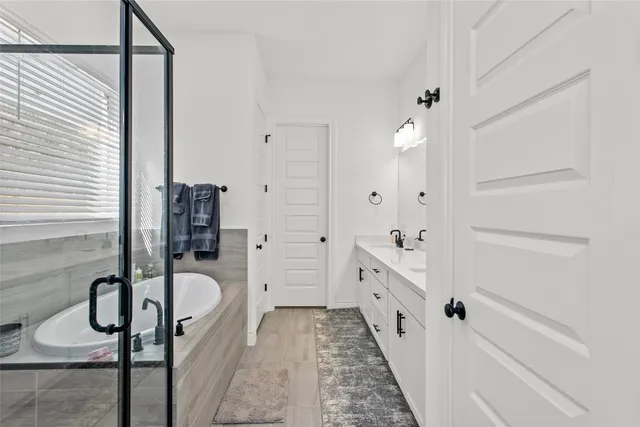 a bathroom with a sink and tub