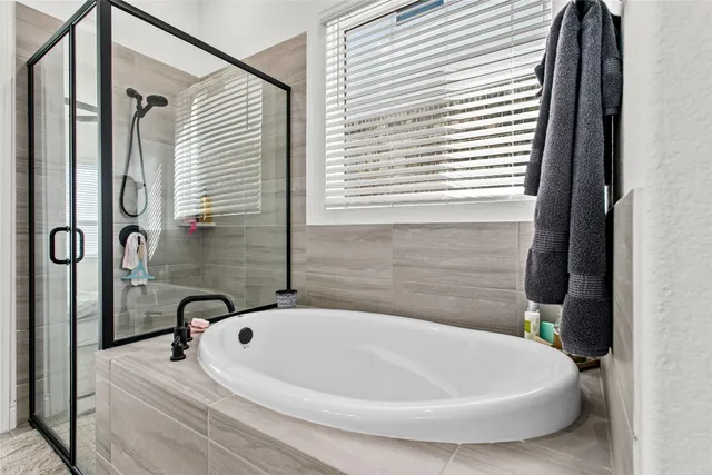 a white bath tub sitting in a bathroom