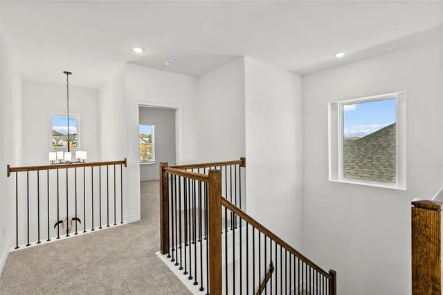 a view of a hallway with windows