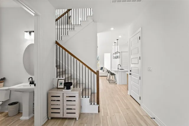 a view of a hallway with stairs