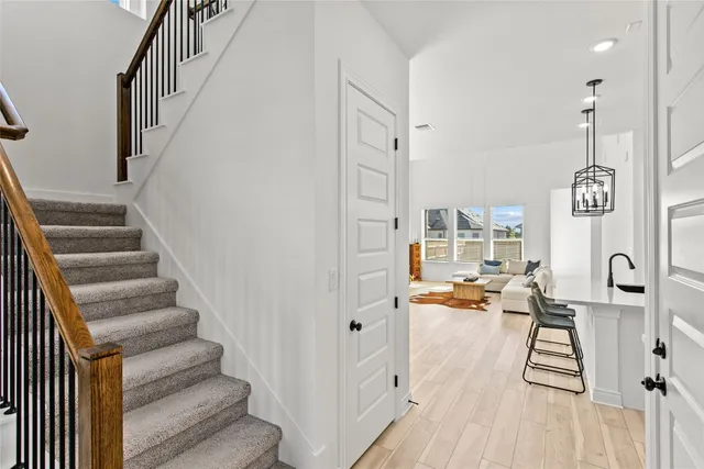 a view of entryway and hall with wooden floor