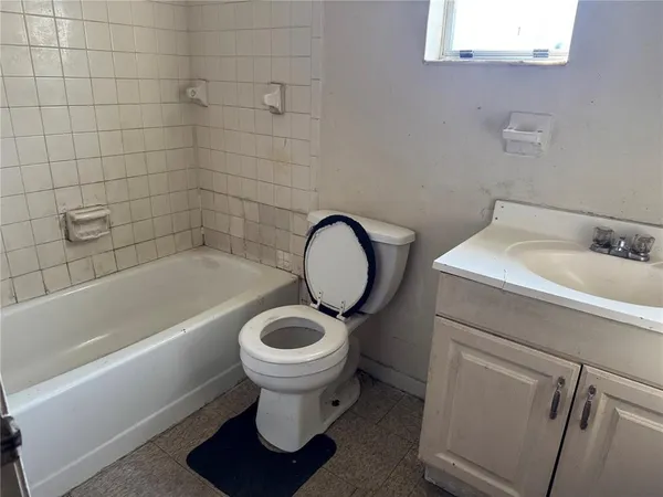 a bathroom with a sink toilet and bathtub