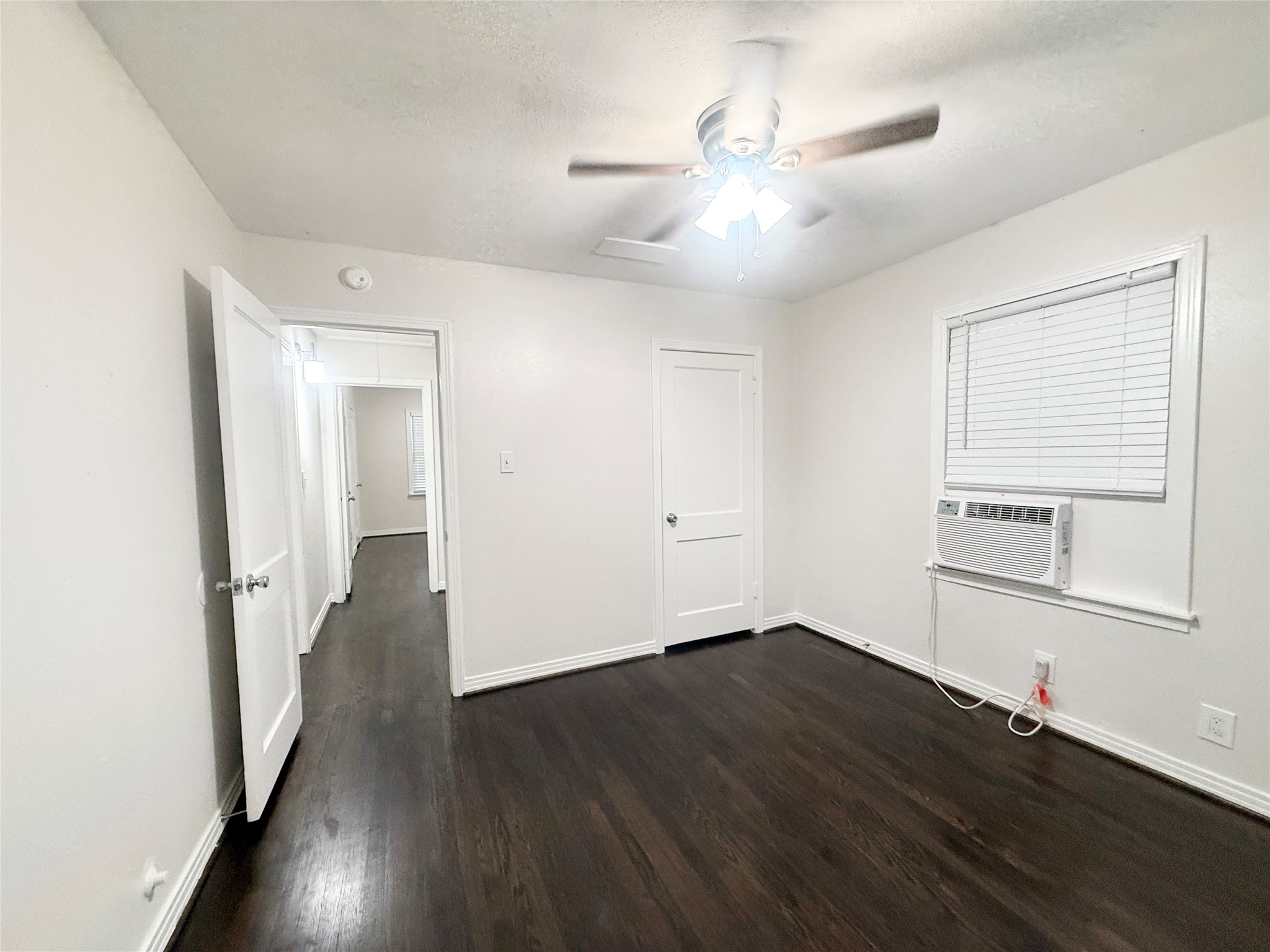 832 South Anderson Street Angleton, TX 77515 - Photo 16 of 19 wooden floor in an empty room with a window
