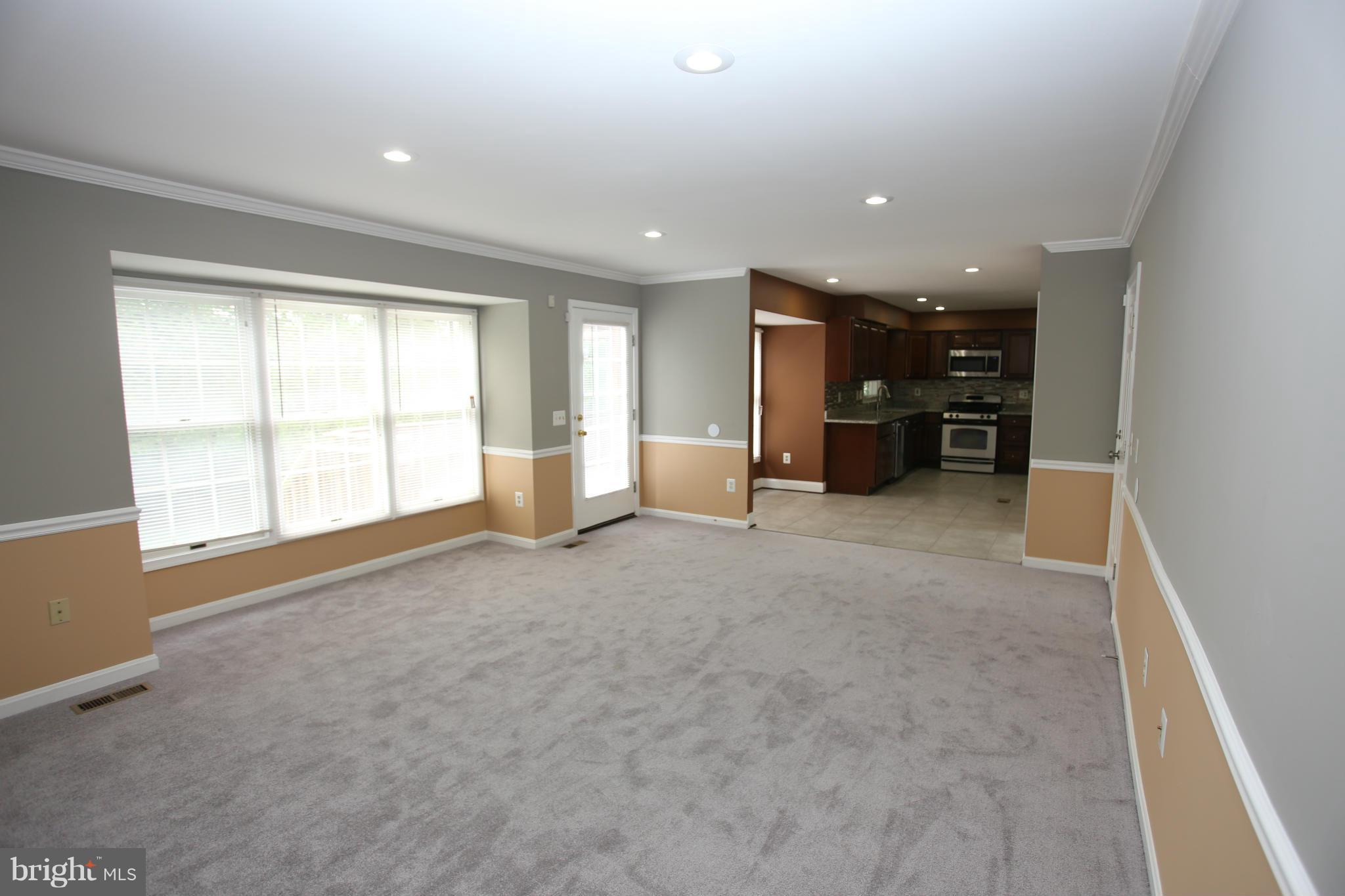 703 Monarch Ridge Road Frederick, MD 21703 - Photo 12 of 30 an empty room with furniture and window