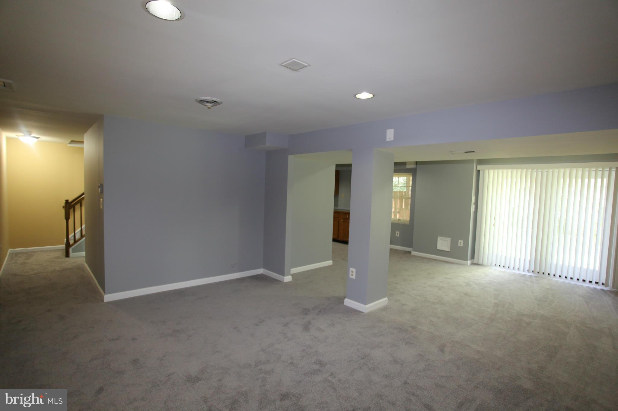 703 Monarch Ridge Road Frederick, MD 21703 - Photo 24 of 30 a view of a livingroom with an empty space and window