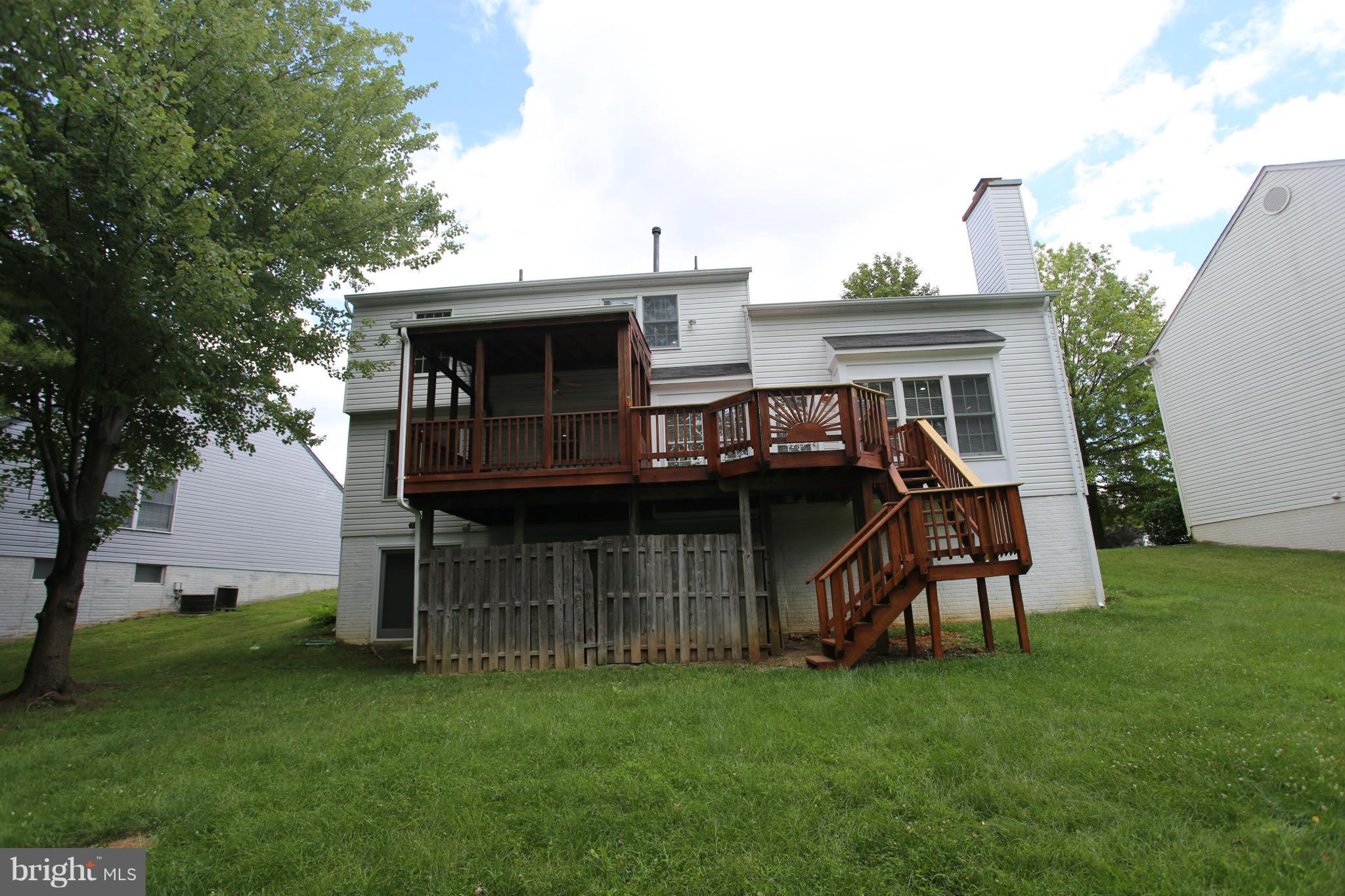 703 Monarch Ridge Road Frederick, MD 21703 - Photo 28 of 30 a view of a house with a backyard