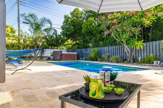 a view of swimming pool with a patio