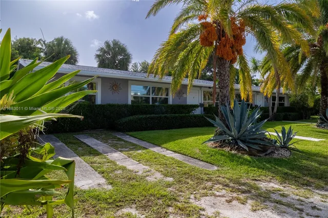 a view of a backyard with a garden