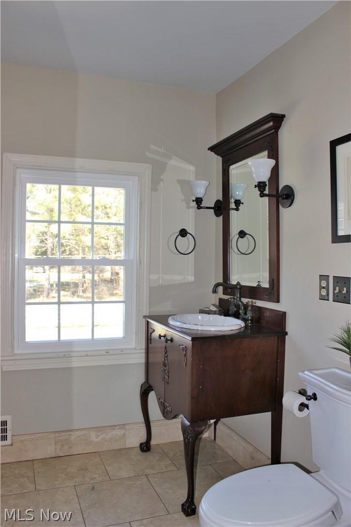 7123 Cedar Road Chesterland, OH 44026 - Photo 23 of 35 Master bathroom with matching cabinets and sinks with tile floor and separate tile shower.