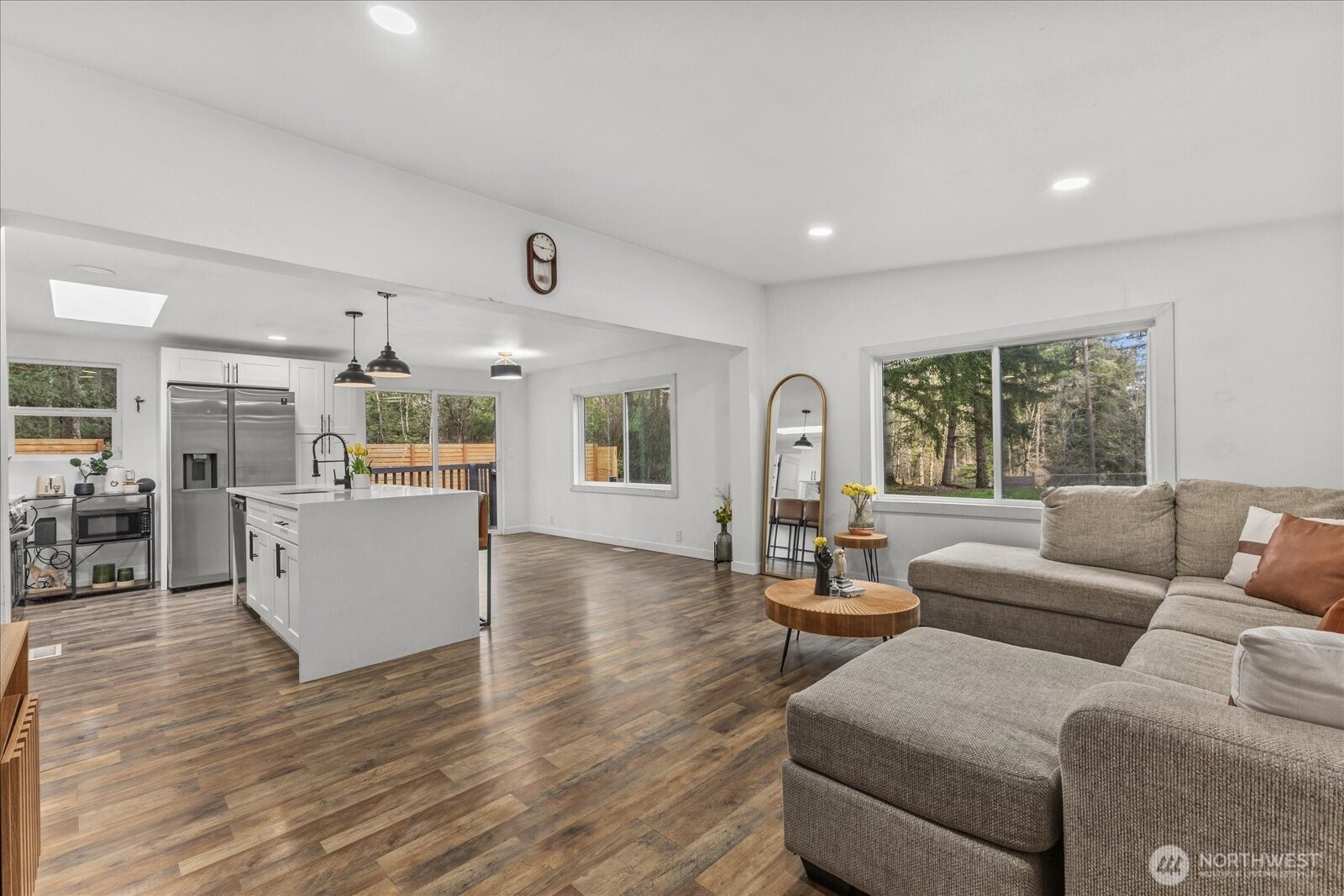 20609 Southeast 245th Place Maple Valley, WA 98038 - Photo 19 of 34 a living room with furniture and a large window