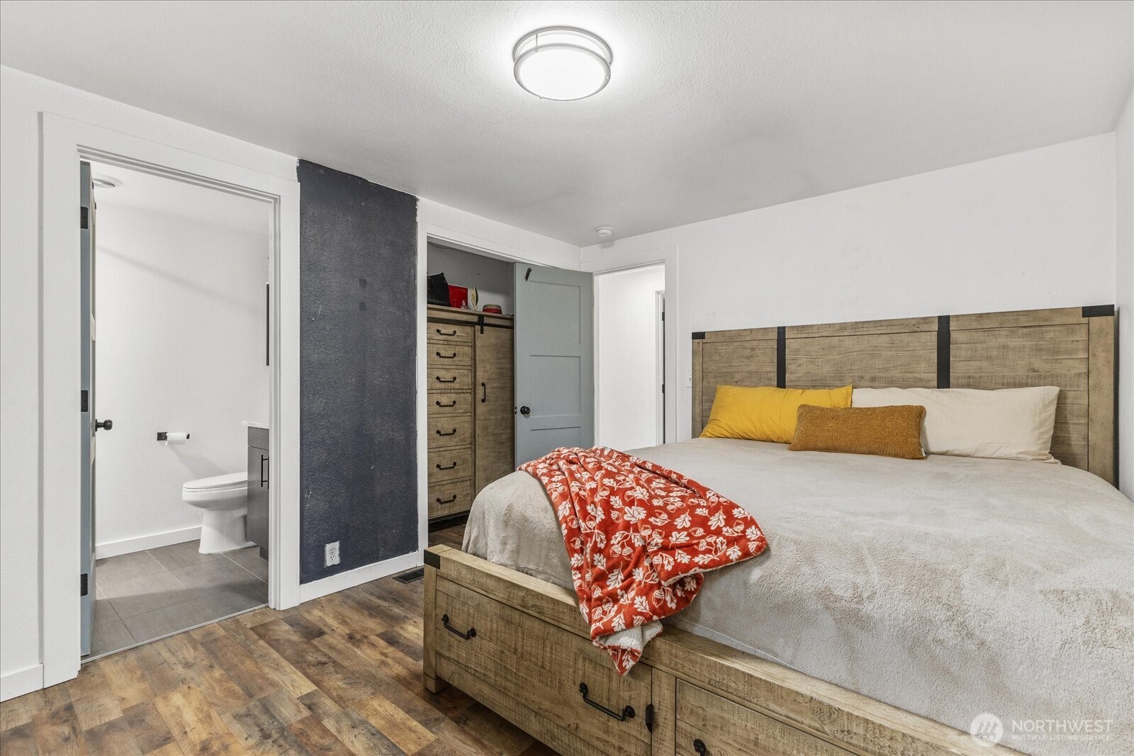 20609 Southeast 245th Place Maple Valley, WA 98038 - Photo 21 of 34 a bedroom with a bed and a lamp