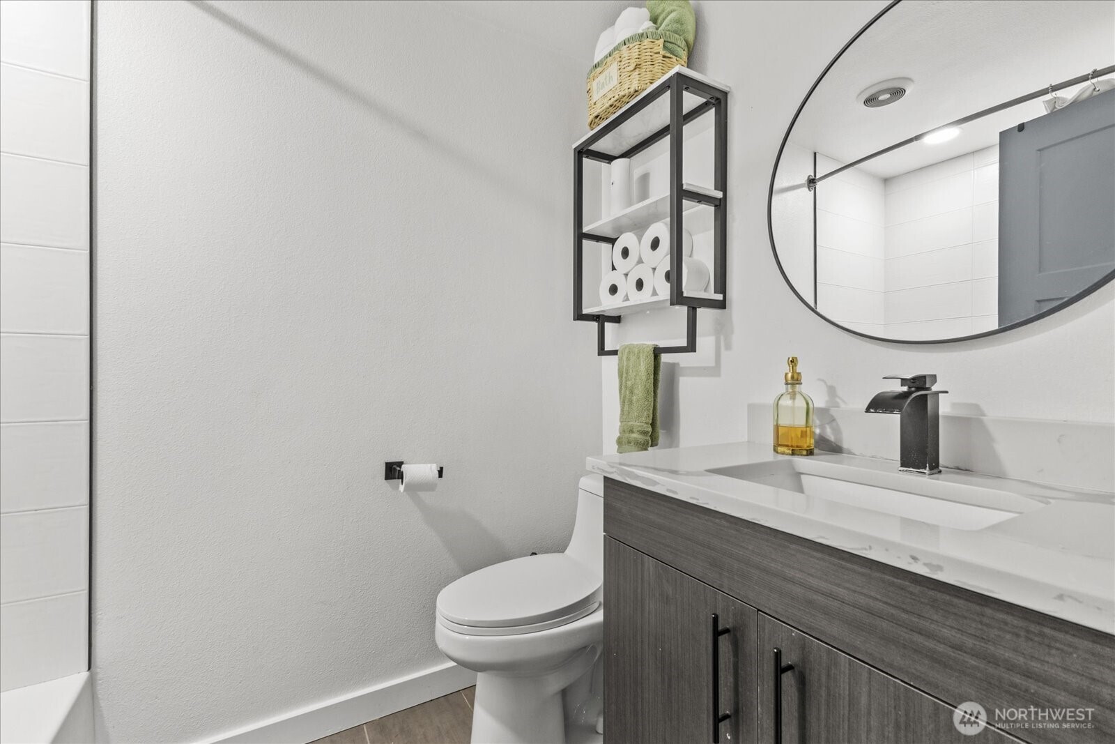 20609 Southeast 245th Place Maple Valley, WA 98038 - Photo 22 of 34 a bathroom with a granite countertop toilet sink and mirror
