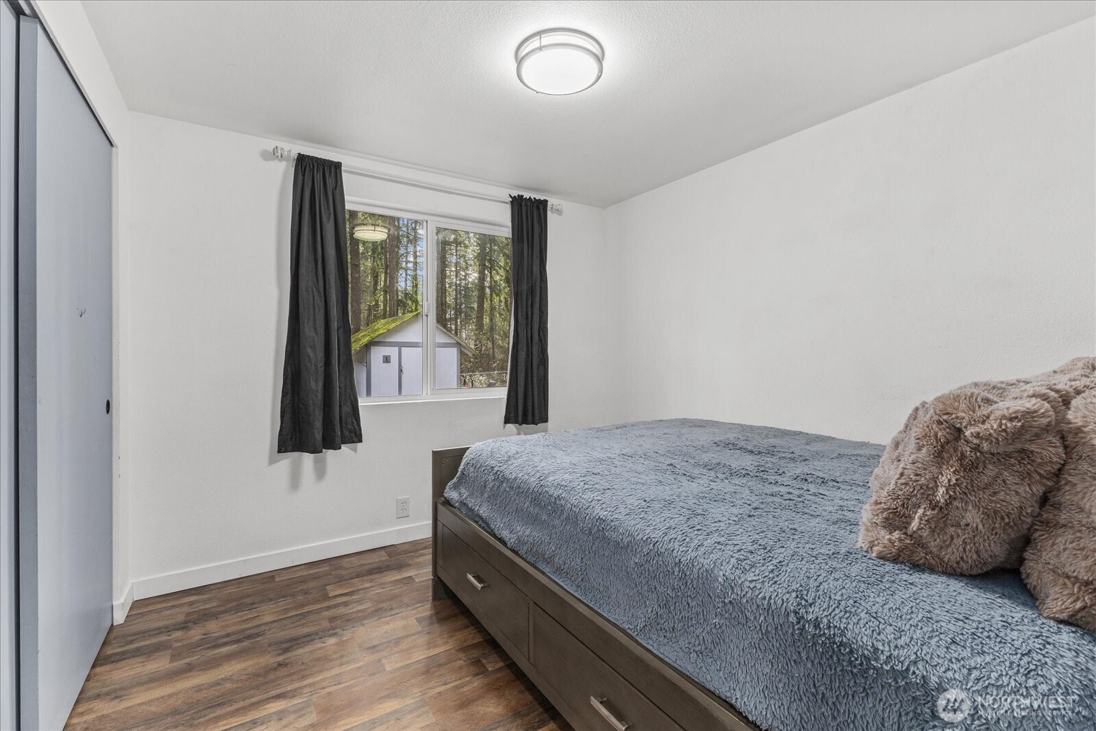 20609 Southeast 245th Place Maple Valley, WA 98038 - Photo 25 of 34 a bedroom with a bed and a window