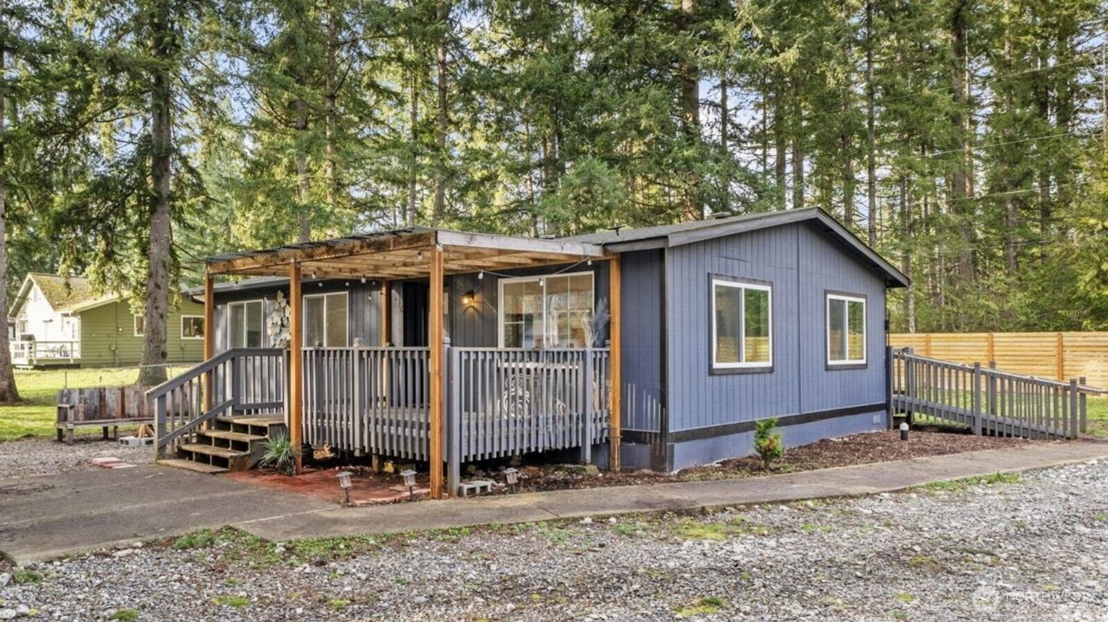 20609 Southeast 245th Place Maple Valley, WA 98038 - Photo 3 of 34 a front view of a house with garden