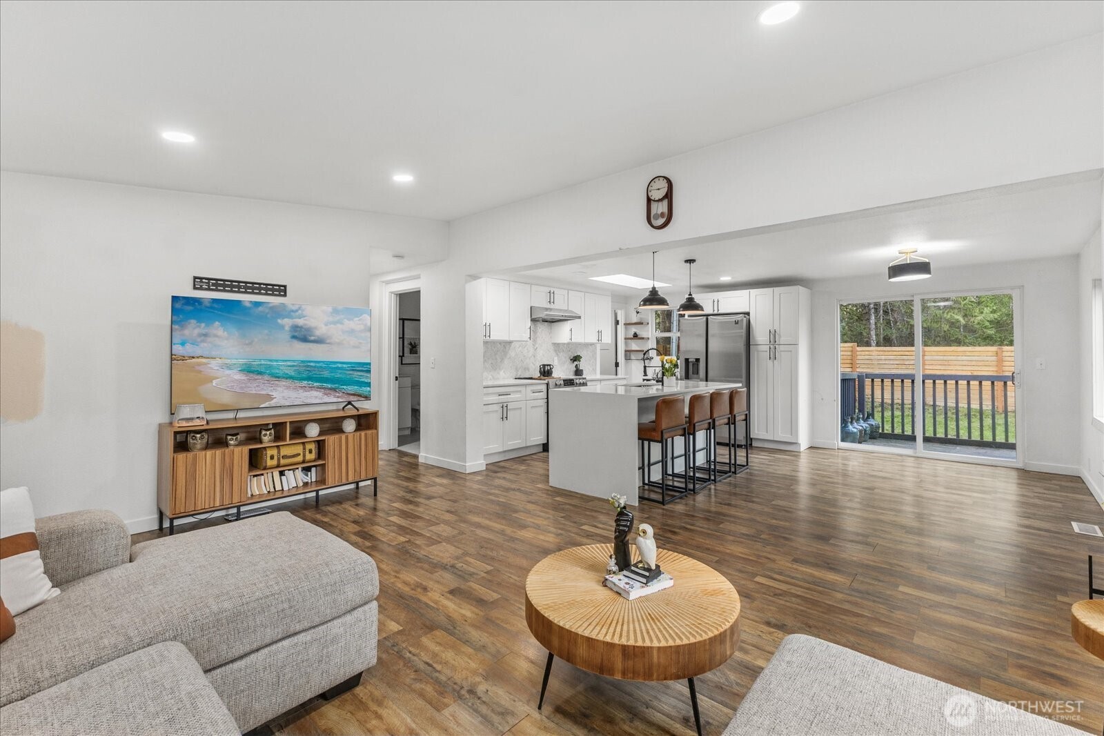 20609 Southeast 245th Place Maple Valley, WA 98038 - Photo 10 of 34 a living room with furniture and a wooden floor