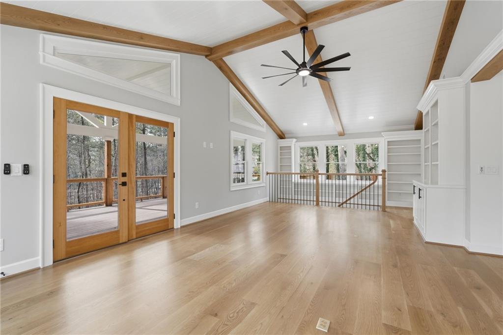 3454 Green Apple Road Gainesville, GA 30506 - Photo 14 of 115 a view of a livingroom with wooden floor and a ceiling fan
