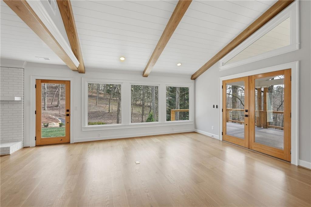3454 Green Apple Road Gainesville, GA 30506 - Photo 16 of 115 a view of an empty room with wooden floor and a window