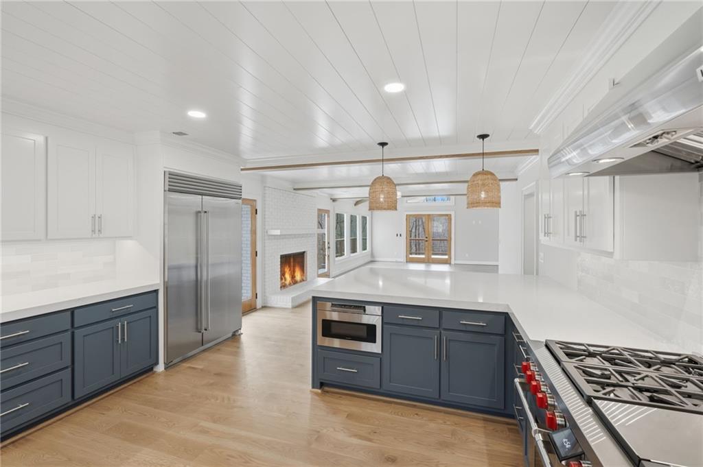 3454 Green Apple Road Gainesville, GA 30506 - Photo 29 of 115 a kitchen with stainless steel appliances granite countertop a stove and a refrigerator