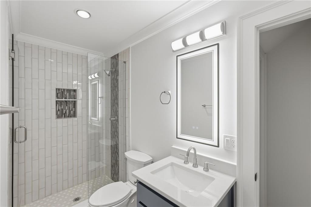 3454 Green Apple Road Gainesville, GA 30506 - Photo 61 of 115 a bathroom with a sink toilet and shower