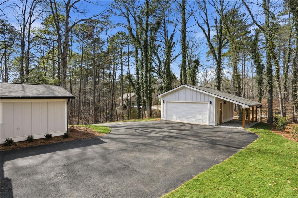 3454 Green Apple Road Gainesville, GA 30506 - Photo 70 of 115 a front view of a house with a yard and garage