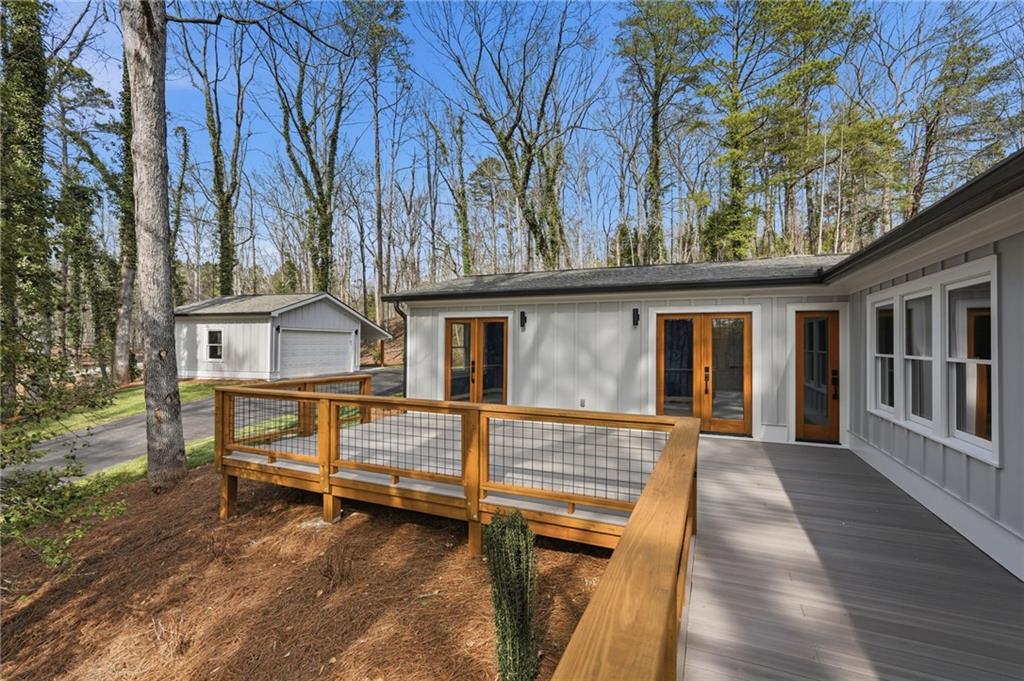 3454 Green Apple Road Gainesville, GA 30506 - Photo 75 of 115 a view of a house with a wooden fence and a floor to ceiling window