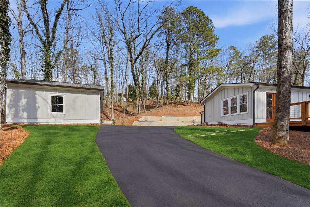 3454 Green Apple Road Gainesville, GA 30506 - Photo 78 of 115 a view of a yard in front of a house with large trees