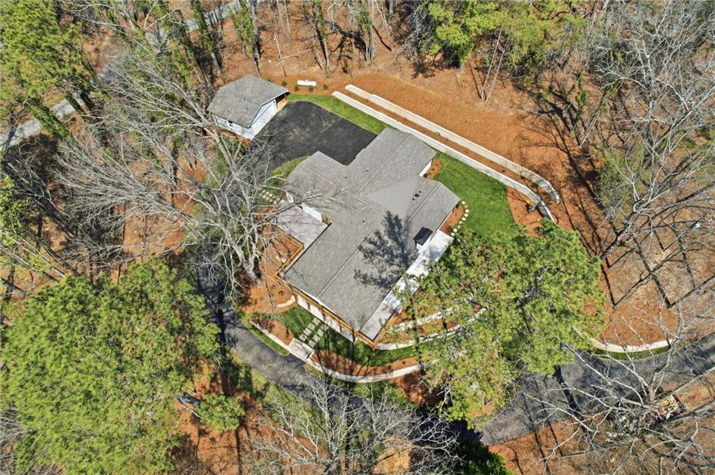 3454 Green Apple Road Gainesville, GA 30506 - Photo 8 of 115 an aerial view of a house with a yard and large trees