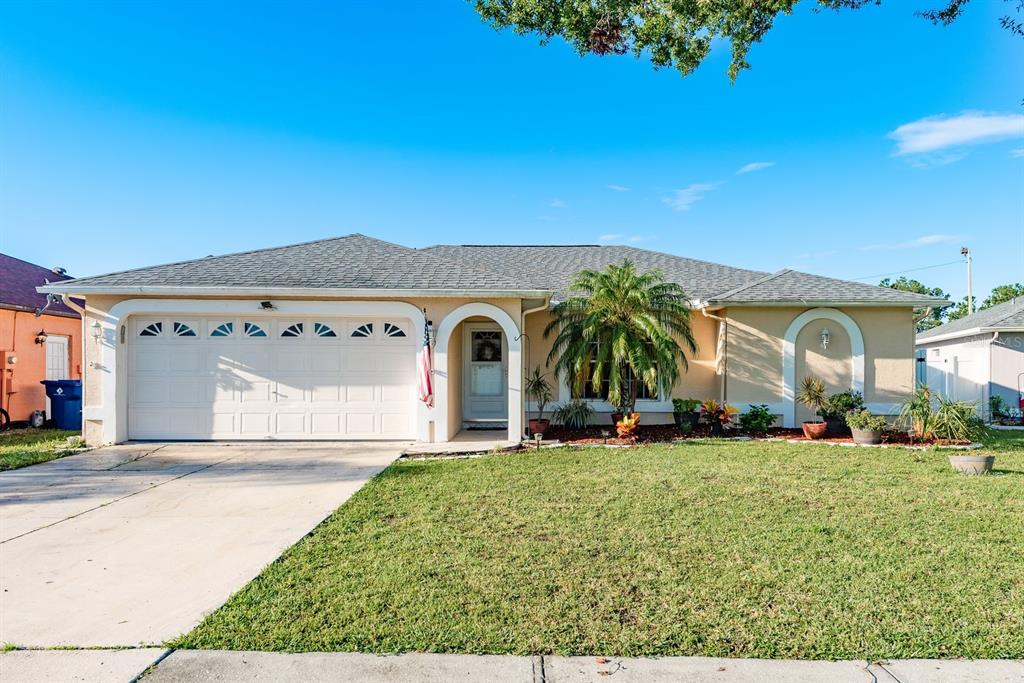 7924 Sancho Court New Port Richey, FL 34653 - Photo 1 of 1 a front view of a house with garden