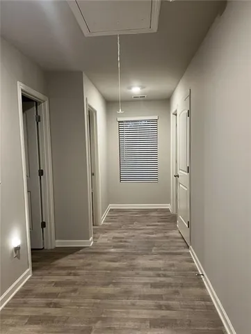 an empty room with wooden floor