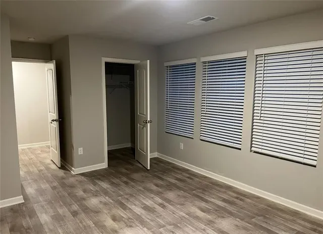 a view of a field of grass and trees