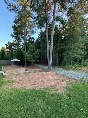 a backyard of a house with lots of green space