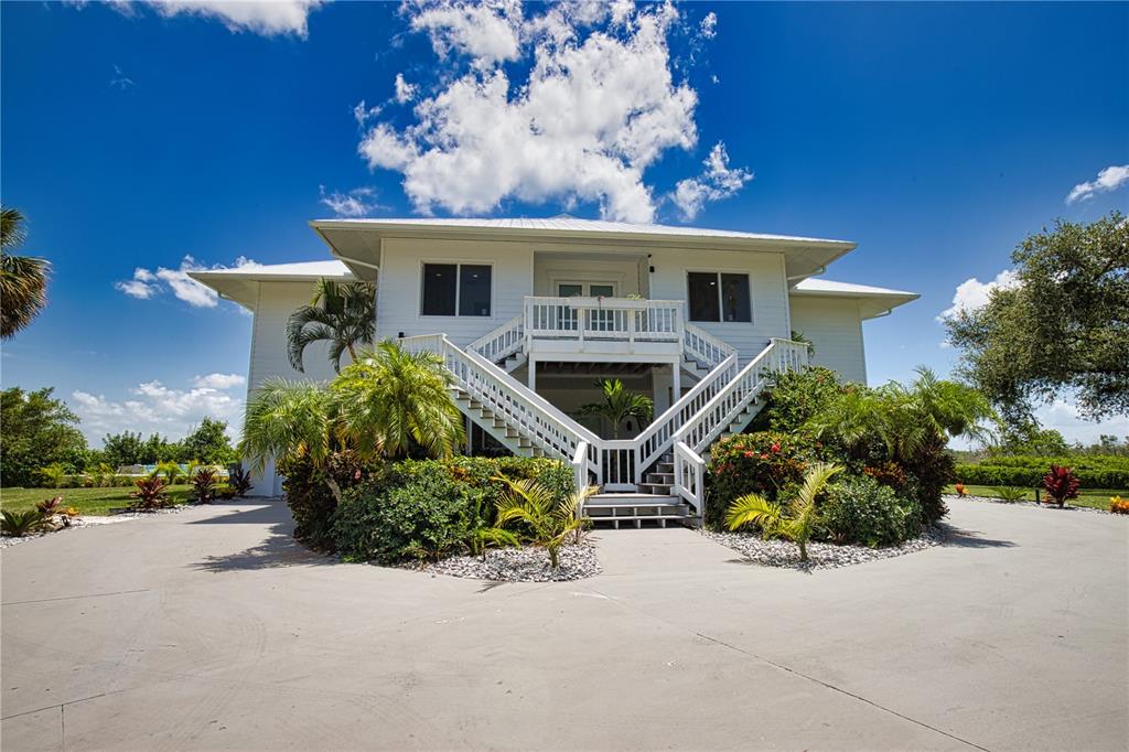13064 Via Flavia Placida, FL 33946 - Photo 1 of 75 front view of a house with a yard